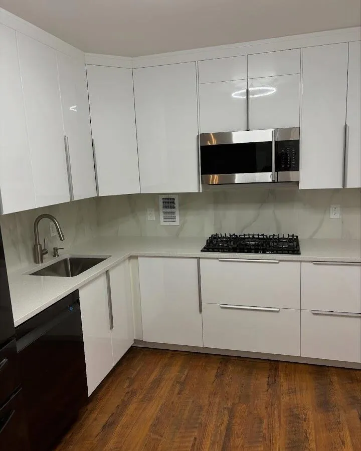 Restored kitchen with white cabinets after water damage in Rockland